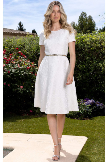 Formal white dress in satin jacquard with floral motifs