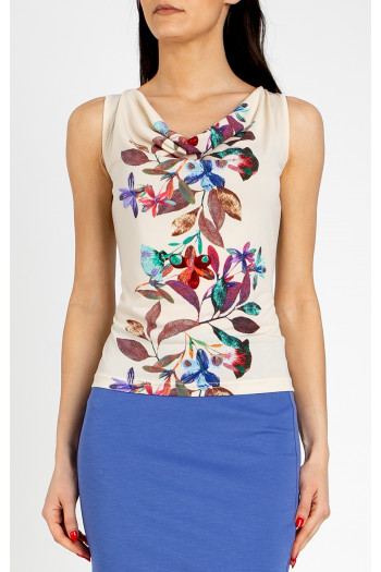 Stylish blouse with a draped neckline in Vanilla Ice, featuring a vertical floral border [1]