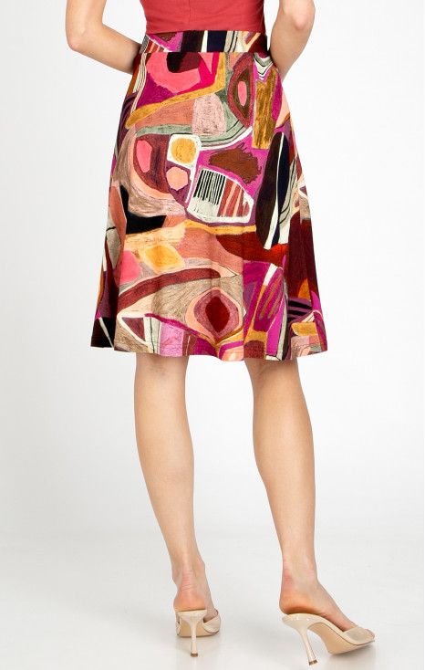 Short flared skirt made of lightweight knit fabric in a graphic print in Brick and Fuchsia