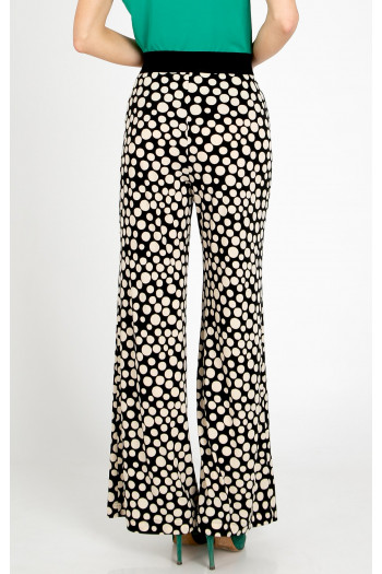 Trousers made of knit jersey fabric with a striking large polka dot print [1]