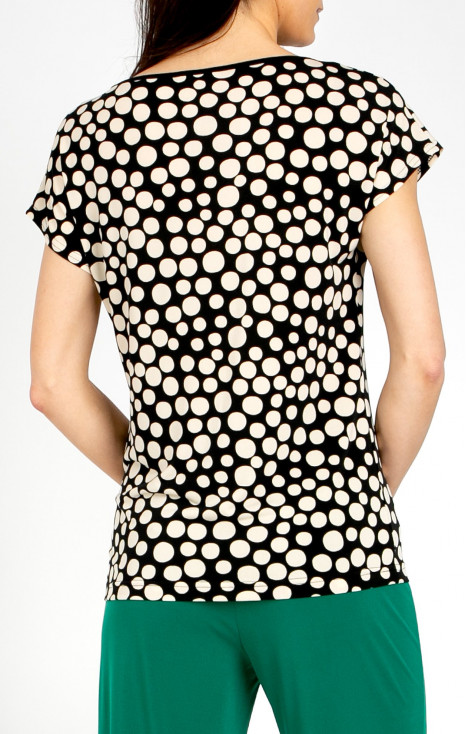 Elegant blouse with a striking large polka dot print
