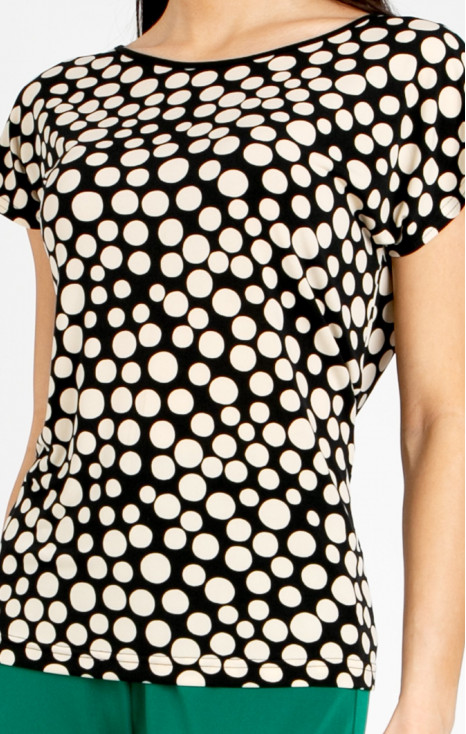 Elegant blouse with a striking large polka dot print